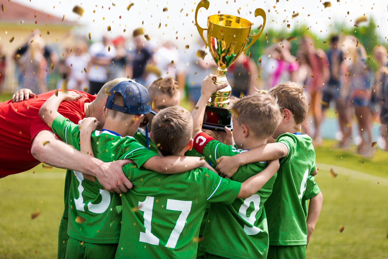 Happy Kids Winning Sports Tournament. Schoolboys Standing with a